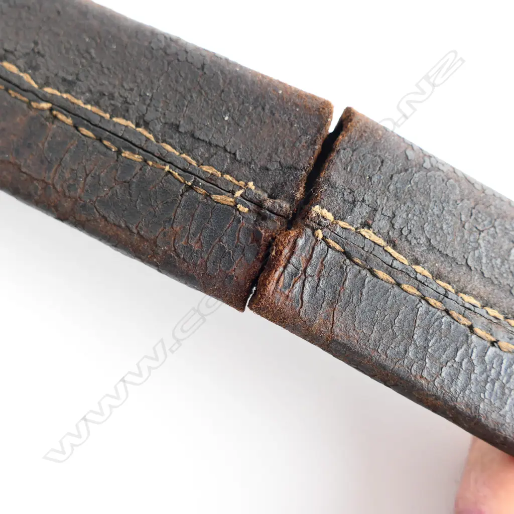 A c.1830 Pioneer Rifleman's sawback hanger, with spear point 600mm blade, brass P-guard hilt with lion's head pommel. Leather scabbard (nearly cracked through) with brass fittings Image 1++