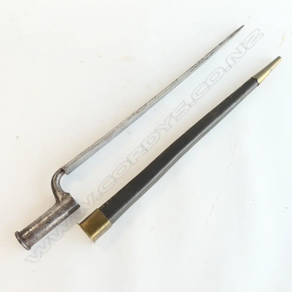 British ‘Brown Bess’ Socket Bayonet and Scabbard, good 430mm blade carries ordnance inspectors mark and minor staining.  The leather scabbard with brass fittings. Image 1++