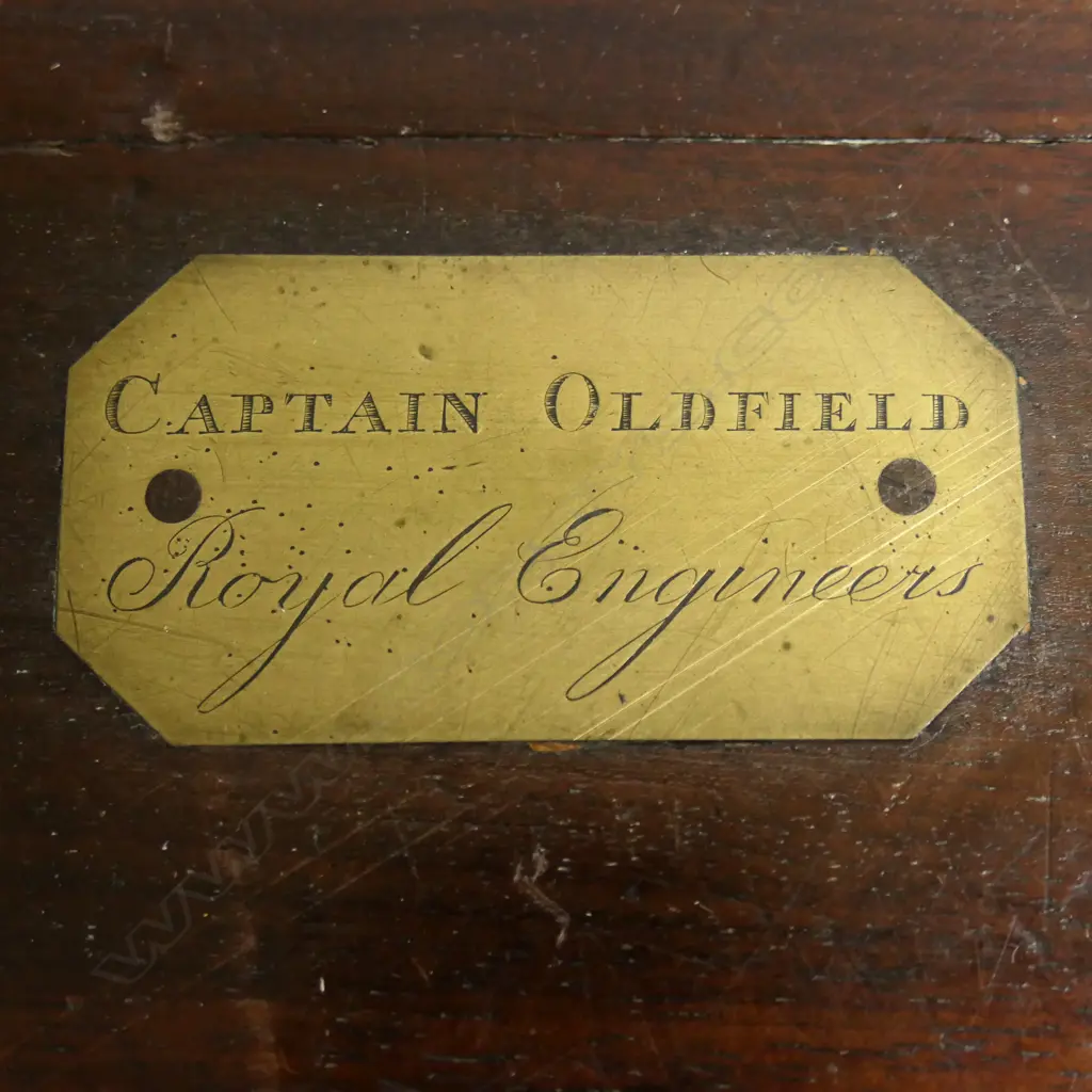An Officer's mahogany writing box with engraved brass plaque to the lid ‘Captain Oldfield. Royal Engineers’, brass capped and bound and recessed brass handles, 455 x 250 x 145mm. Image 1++