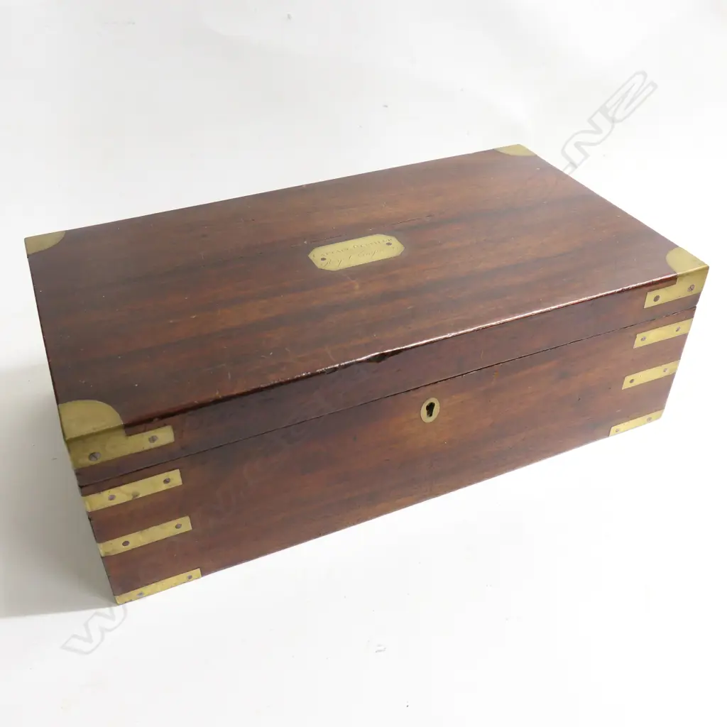 An Officer's mahogany writing box with engraved brass plaque to the lid ‘Captain Oldfield. Royal Engineers’, brass capped and bound and recessed brass handles, 455 x 250 x 145mm. Image 1++