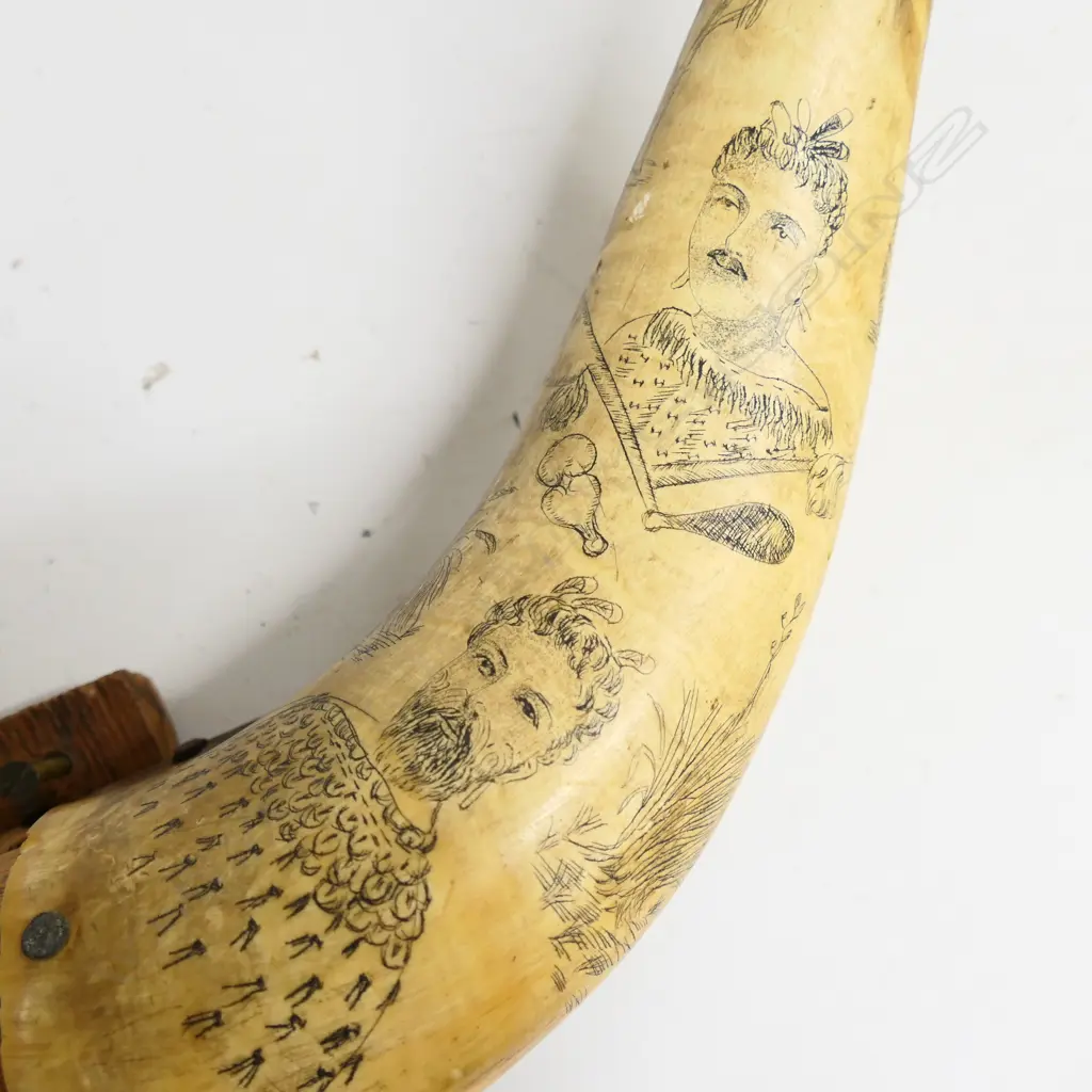 A pair of scrimshaw bullock horns decoratively worked with Māori portraits, weapons, native birds and landscapes, fitted to a wooden mount. W.560mm. Image 1++