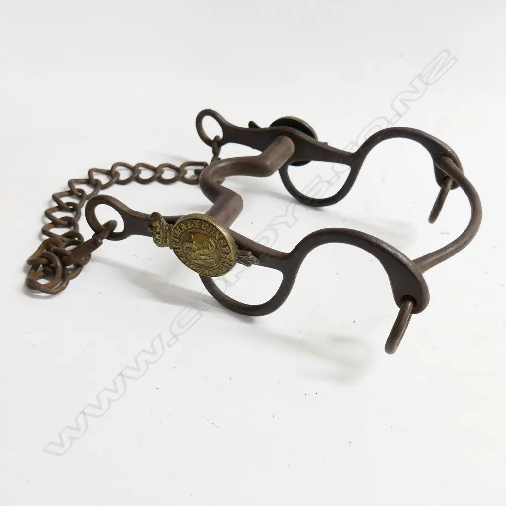 A Victorian military, steel horse bit with brass crowned garter bearing motto and cypher in bosses to either side. Image 1++