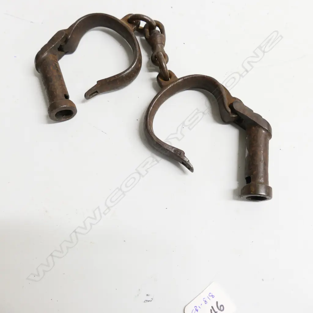 A pair of steel handcuffs, Darby type, not adjustable, with swivel links between the manacles, Image 1++