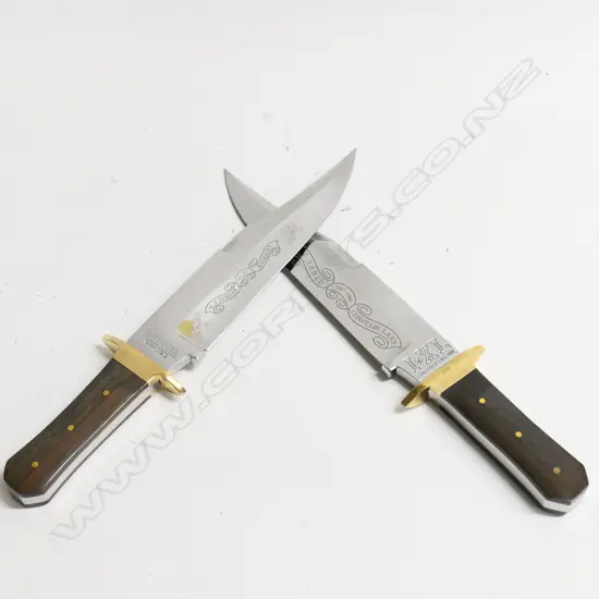 Two substantial 'G. Wostenholm, Washington Works' clip blade 10" Bowie knives by I*XL Sheffield, England, with rosewood coffin handles and brass cross guards,