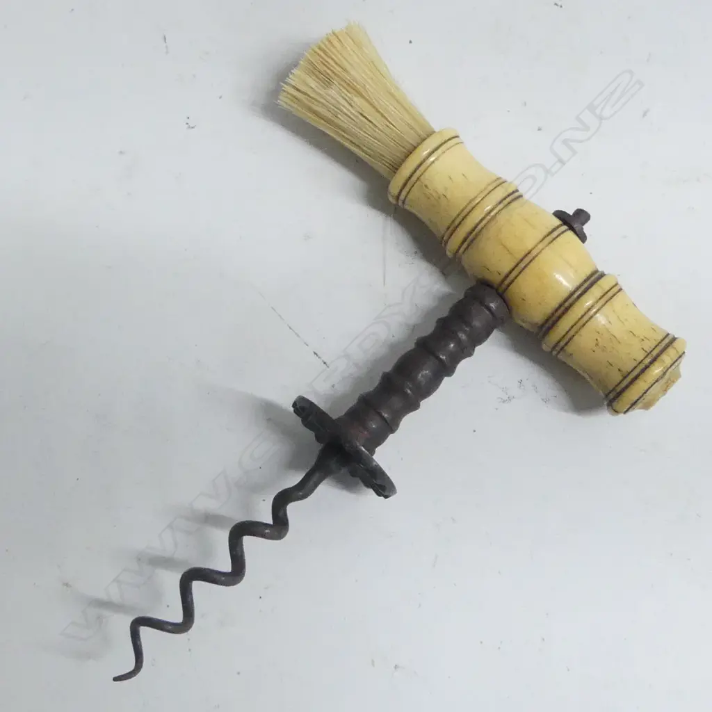 A Victorian period bone handled corkscrew with bristle brush and steel helix. Image 1++