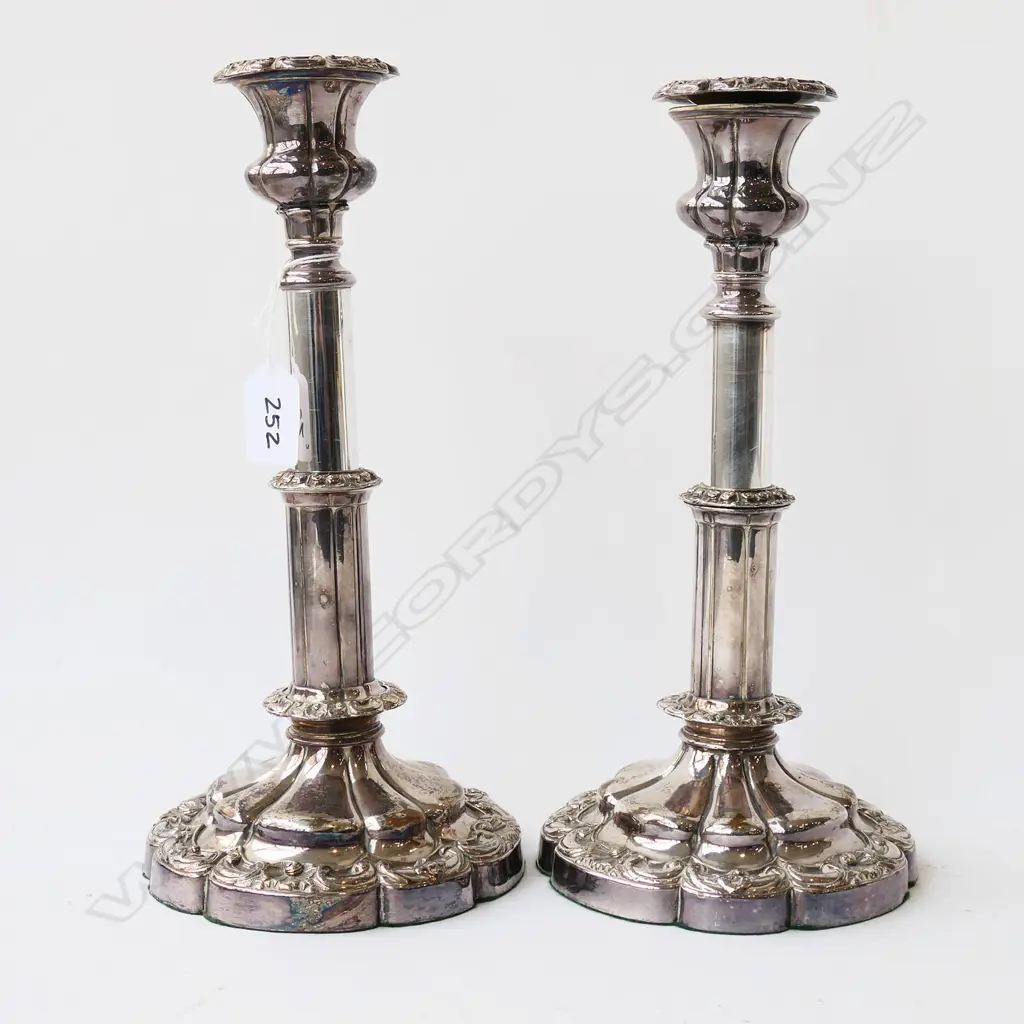 A pair of 19thC Old Sheffield Plate telescopic candlesticks. H.280mm extended. Note:  one telescopic extension faulted (does not remain extended and falls down). Dia. nozzle, 25mm and drip tray 63mm. Image 1++