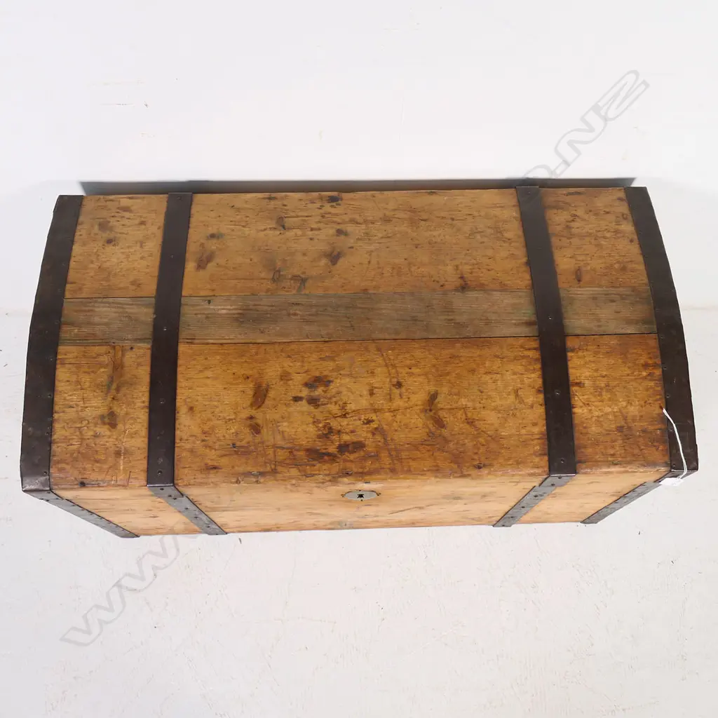 A Victorian pine, steel strapped and bound travelling trunk,  the mildly domed top with original pinned steel edging and strapping, swing handle to each side. 900 x 450 x 500mm. Image 1++
