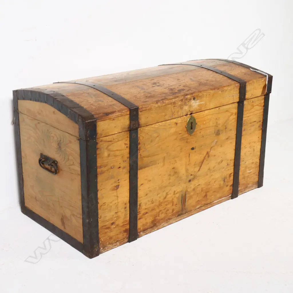 A Victorian pine, steel strapped and bound travelling trunk,  the mildly domed top with original pinned steel edging and strapping, swing handle to each side. 900 x 450 x 500mm. Image 1++
