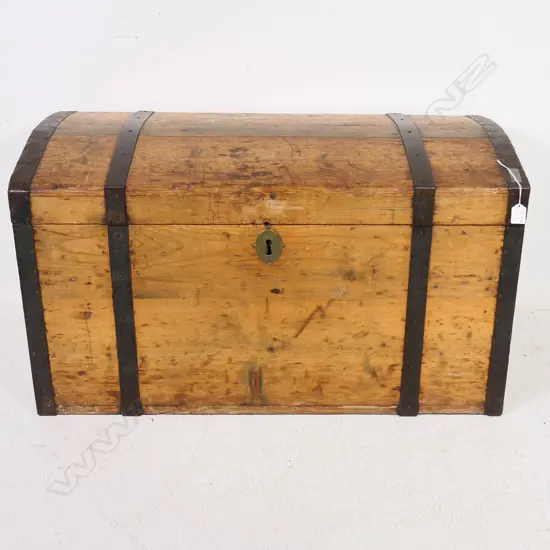 A Victorian pine, steel strapped and bound travelling trunk,  the mildly domed top with original pinned steel edging and strapping, swing handle to each side. 900 x 450 x 500mm.