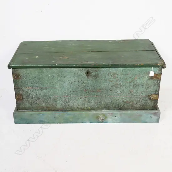 A 19thC green painted footlocker, with rope carry handles and iron strapped dovetailed corners, plinth base, hinged lid, candle box to interior, mortice lock with tongue absent. 950 x 420 x 430mm
