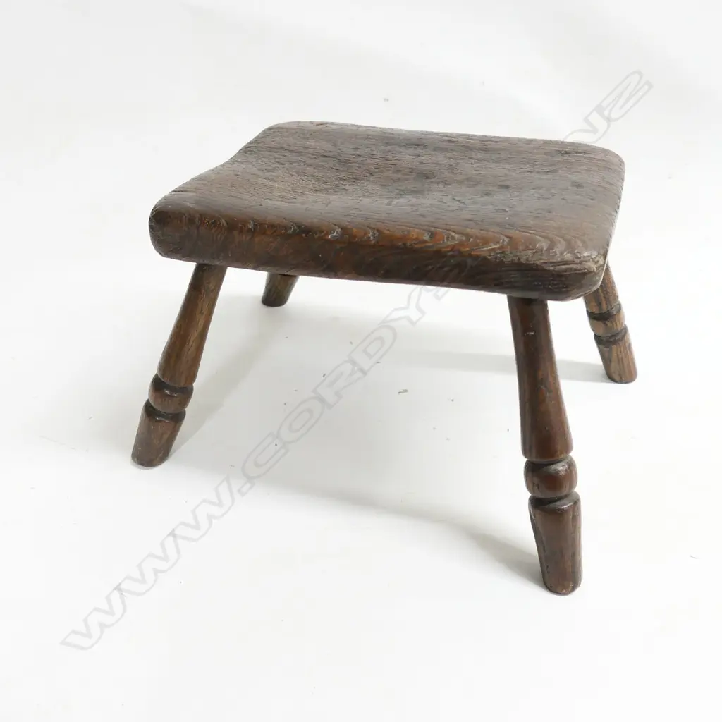 A small oak 19thC milking stool, with four turned legs, H.170mm Image 1++