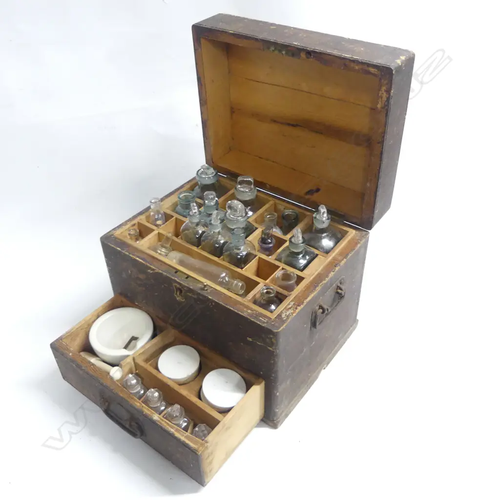 A 19thC English pine apothecary box with fitted interior and single drawer in base, with glass bottles and jars, pestle and mortar, ceramic-lidded jars, etc. 320 x 250 x 270mm. Image 1++