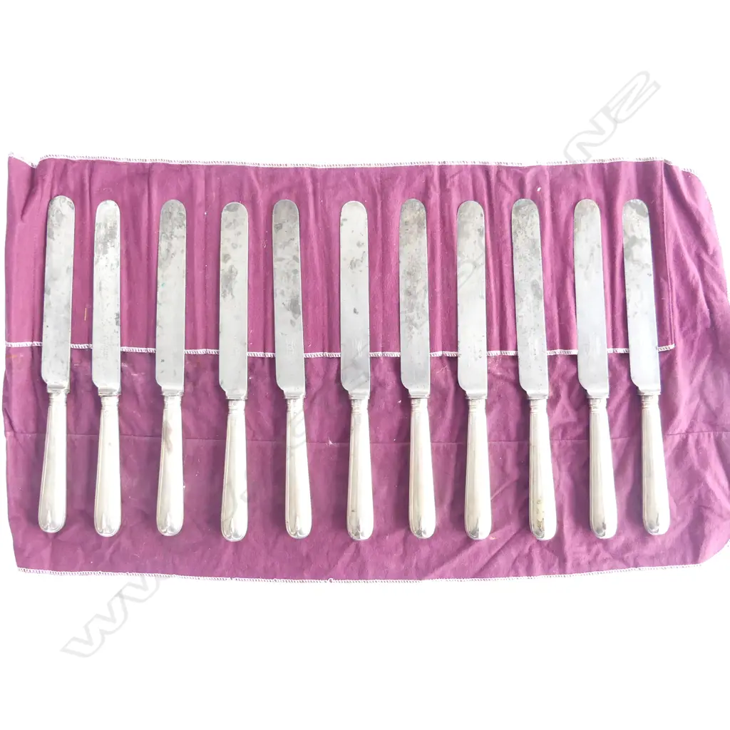 A set of eleven Victorian period silver handled table knives London 1894. The steel blades stamped Mappin and Webb, Sheffield, the wax filled handles with thread edge and raised drop Image 1++