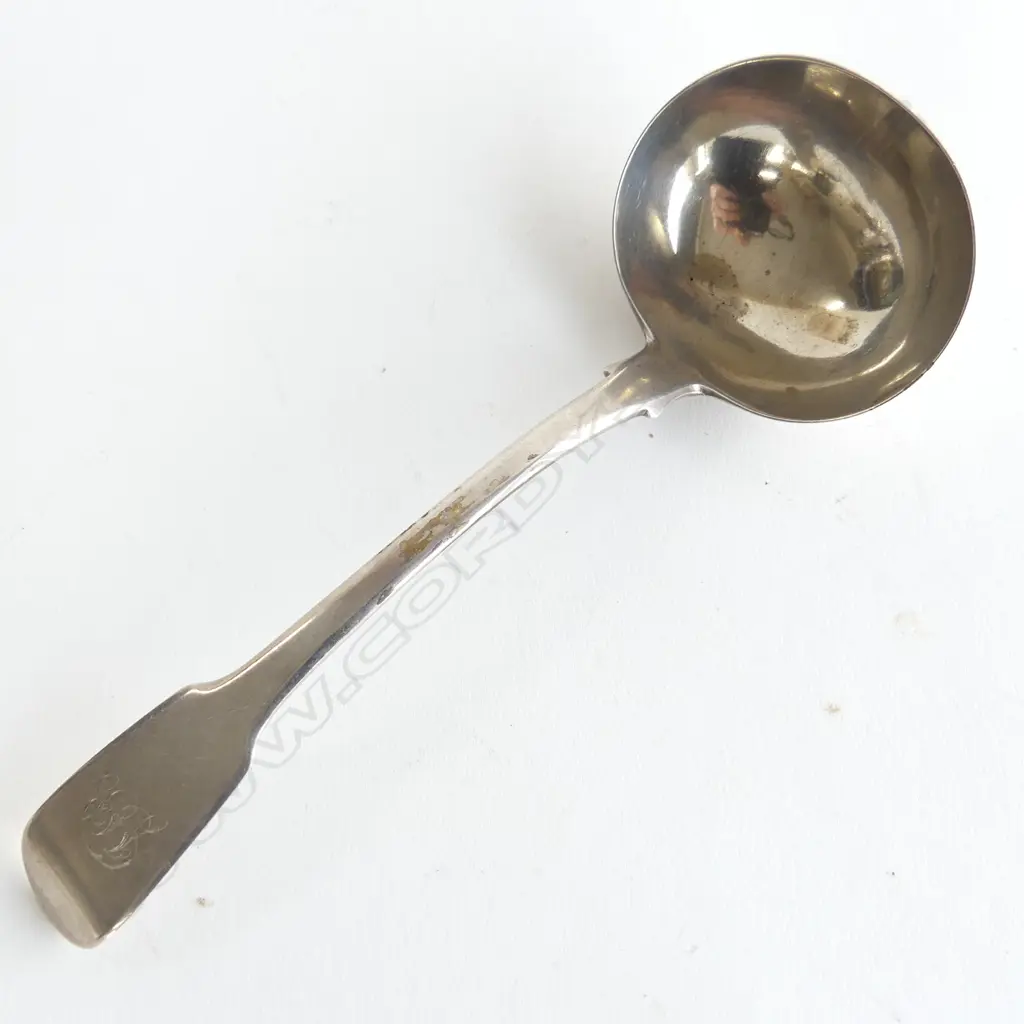 A silver sauce ladle fiddle pattern monogram on handle London 1822. 55gms.  Maker's initials T.B. L.180mm. Image 1++