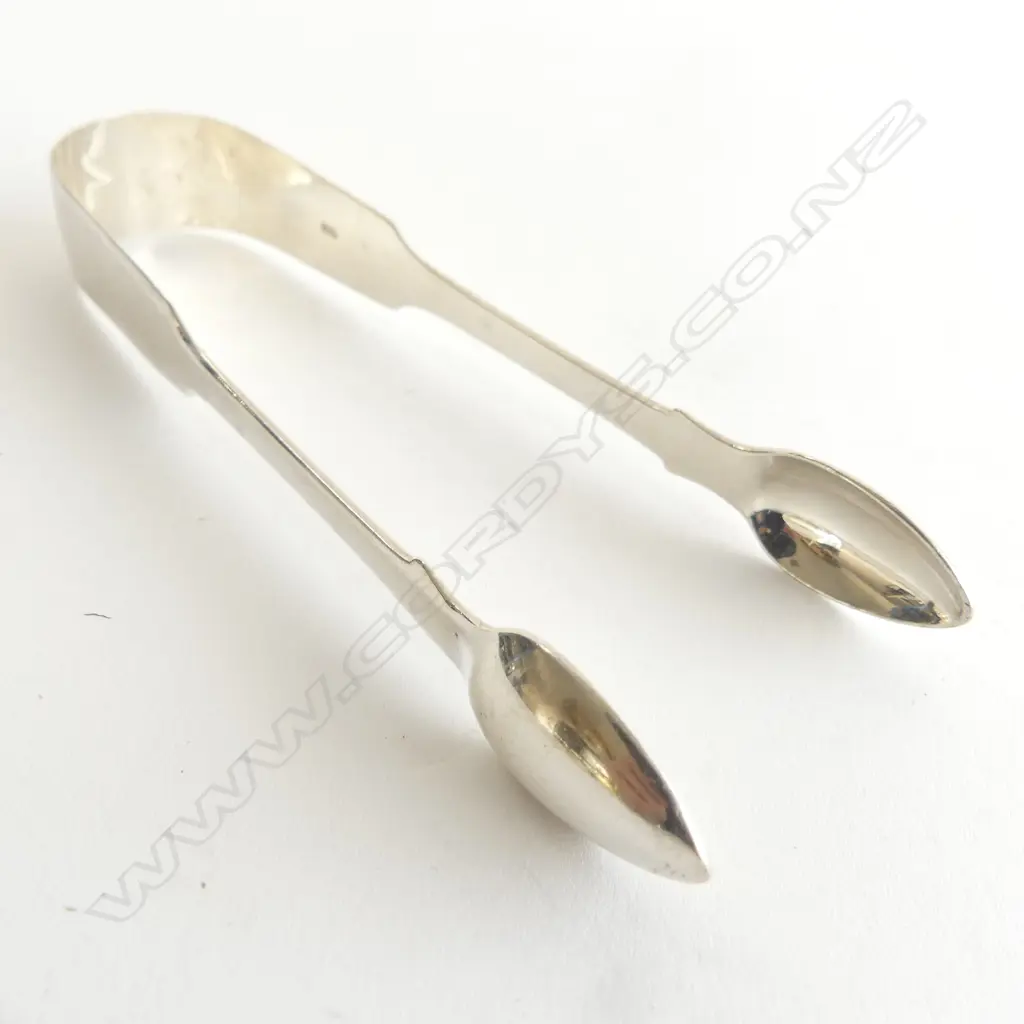 A pair of George IV fiddle pattern silver sugar tongs, London 1821, by James Dicks. 48gm Image 1++