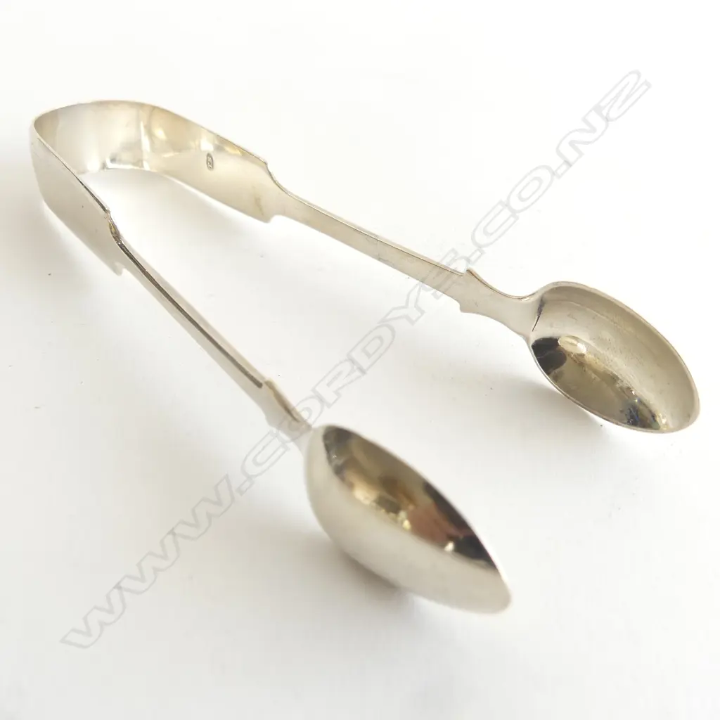 A pair of Victorian period fiddle pattern silver sugar tongs, Exeter 1866. 43gm Image 1++