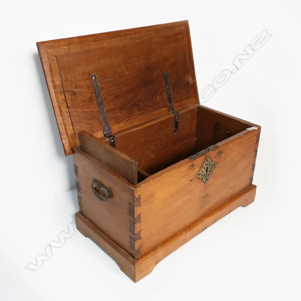 A small teak footlocker, with dovetailed corners and iron carrying handles, a candle box to the interior. 720 x 390 x 390mm. Image 1++