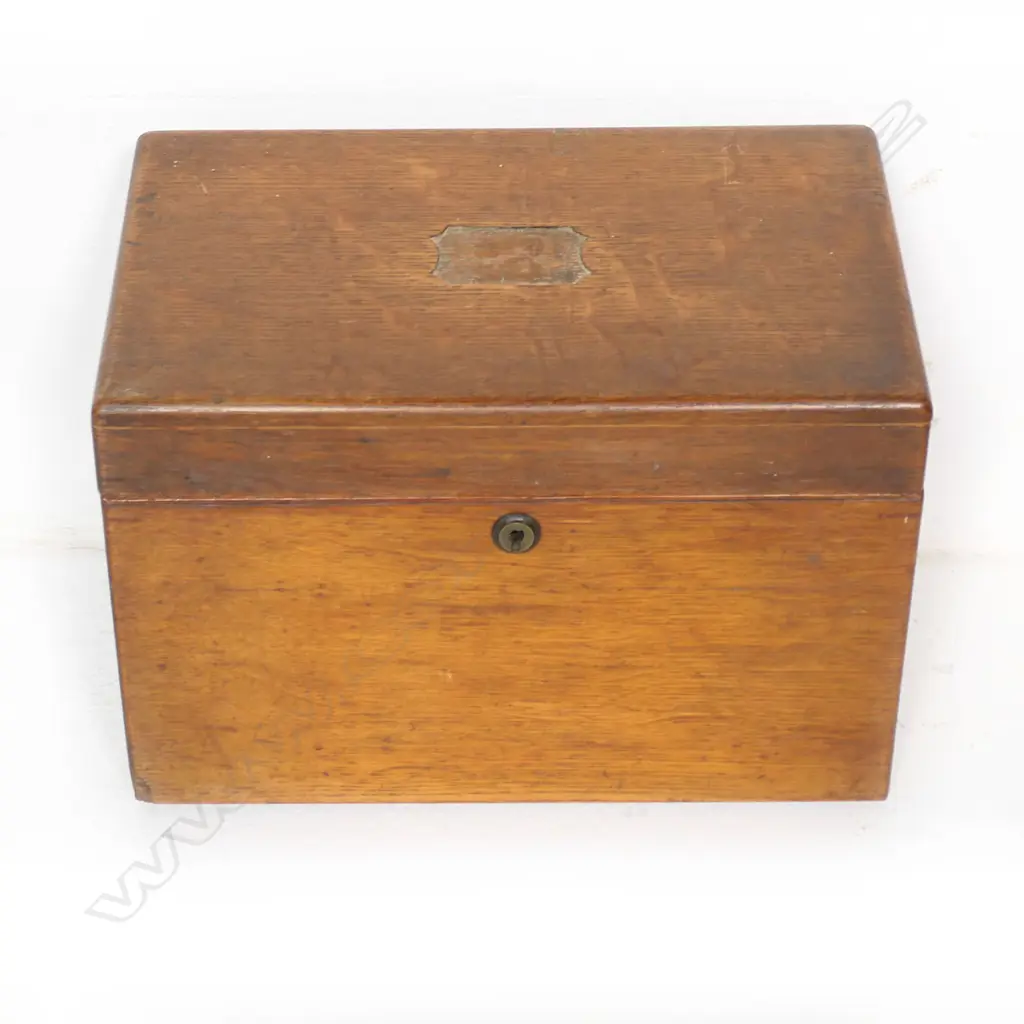 An oak stationary box with secured concealed drawer to the right hand side. Inlaid plaque absent from hinged lid. 310 x 230 x 170mm Image 1++