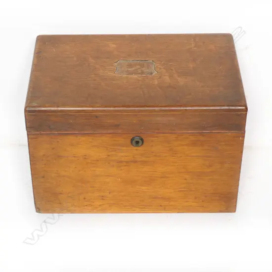 An oak stationary box with secured concealed drawer to the right hand side. Inlaid plaque absent from hinged lid. 310 x 230 x 170mm