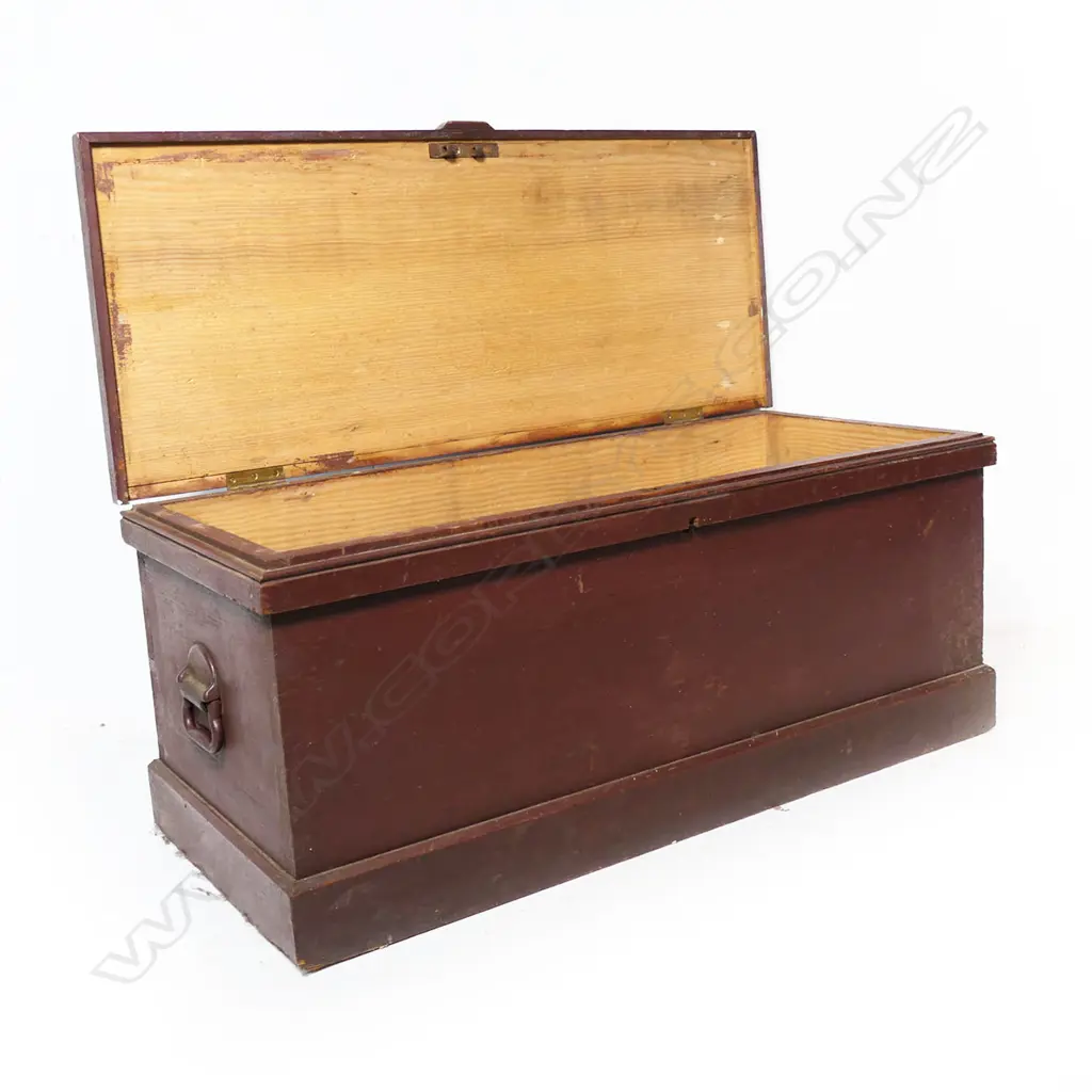 A red painted pine footlocker, with steel carry handles, plinth based. 880 x 380 x 370mm. Image 1++