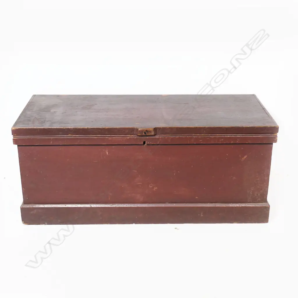 A red painted pine footlocker, with steel carry handles, plinth based. 880 x 380 x 370mm. Image 1++