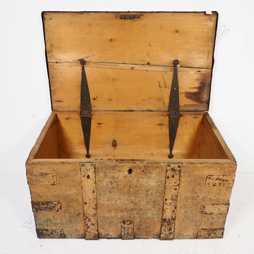 A 19thC iron bound elm trunk with light red-brown remnant paint finish, dovetailed corners with additional iron strapping, iron bale carrying handles, long hinges to interior and mortice lock mechanism. 770 x 470x 400mm Image 1++