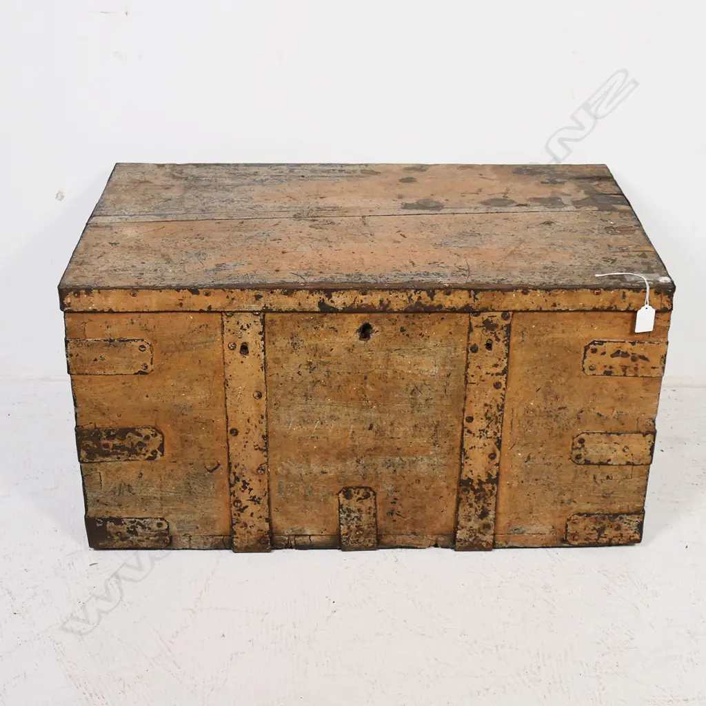 A 19thC iron bound elm trunk with light red-brown remnant paint finish, dovetailed corners with additional iron strapping, iron bale carrying handles, long hinges to interior and mortice lock mechanism. 770 x 470x 400mm Image 1++