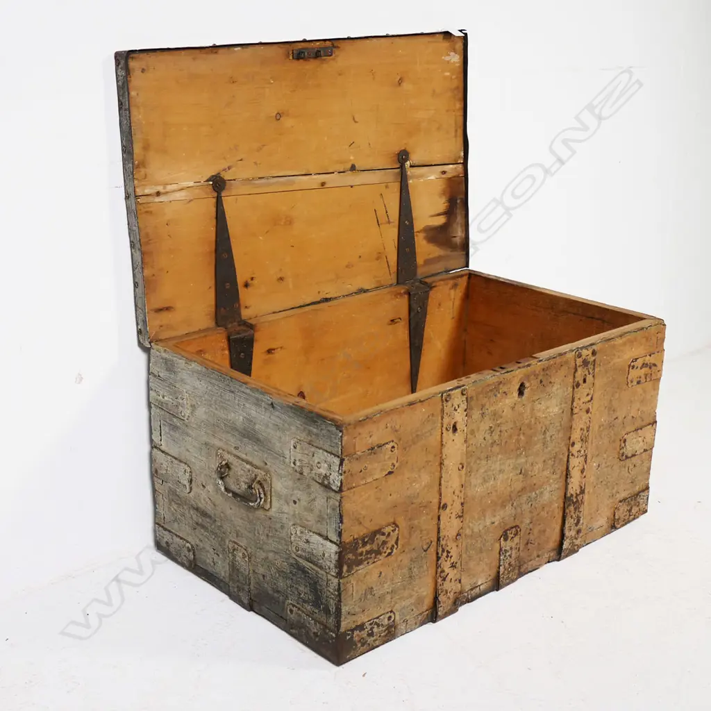 A 19thC iron bound elm trunk with light red-brown remnant paint finish, dovetailed corners with additional iron strapping, iron bale carrying handles, long hinges to interior and mortice lock mechanism. 770 x 470x 400mm Image 1++