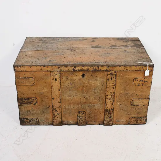 A 19thC iron bound elm trunk with light red-brown remnant paint finish, dovetailed corners with additional iron strapping, iron bale carrying handles, long hinges to interior and mortice lock mechanism. 770 x 470x 400mm