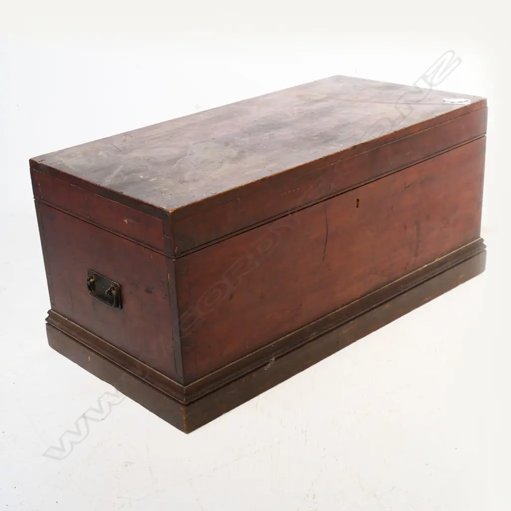 A New Zealand colonial dark stained kauri storage box of plain oblong shape with iron side handles, hinged lid. 910 x 450 x 425mm. Image 1++