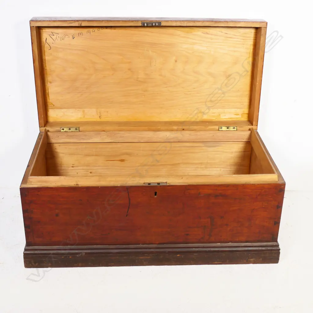 A New Zealand colonial dark stained kauri storage box of plain oblong shape with iron side handles, hinged lid. 910 x 450 x 425mm. Image 1++