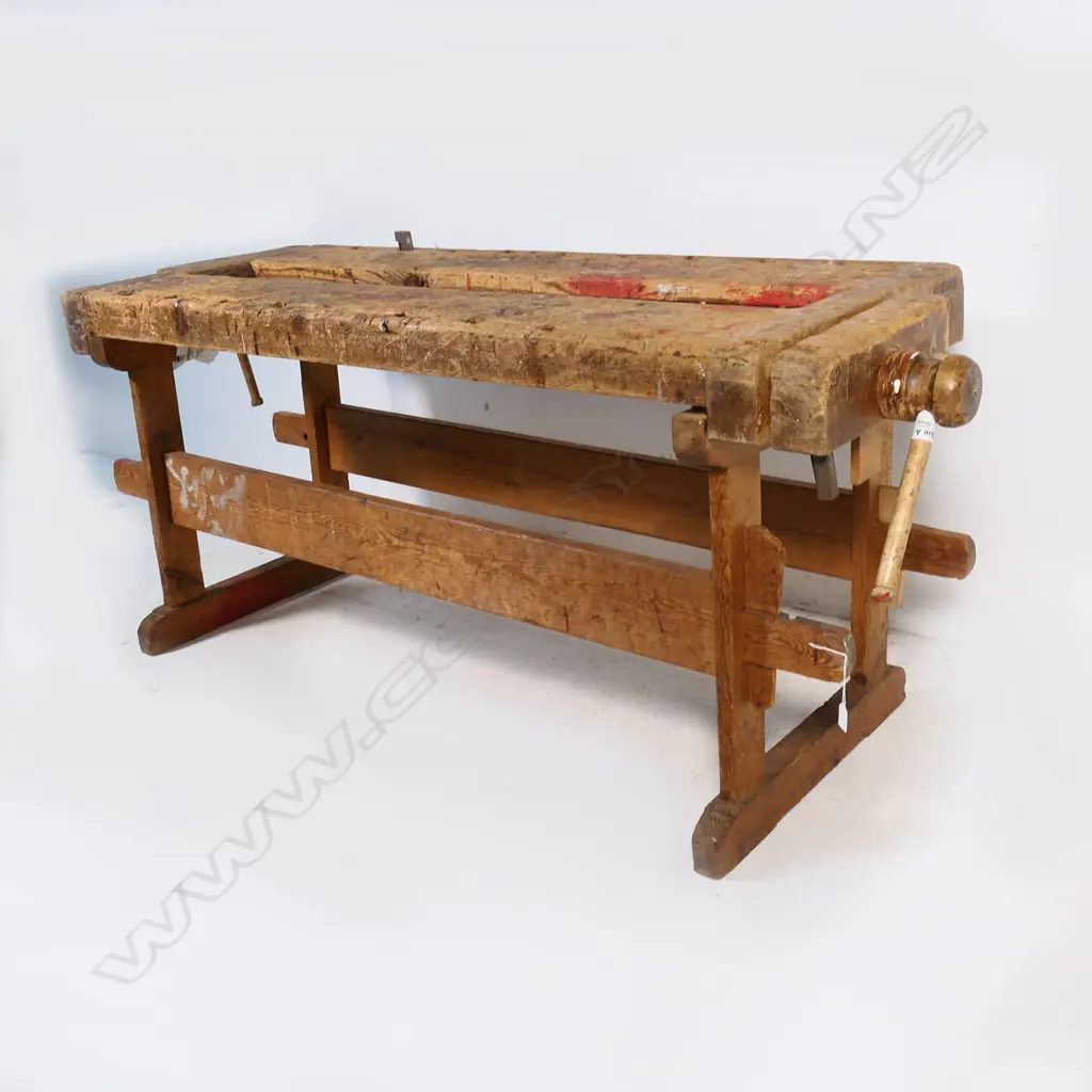 A Pine Carpenter's Bench, with vices to either end, raised on base with pegged morticed stretchers Image 1++