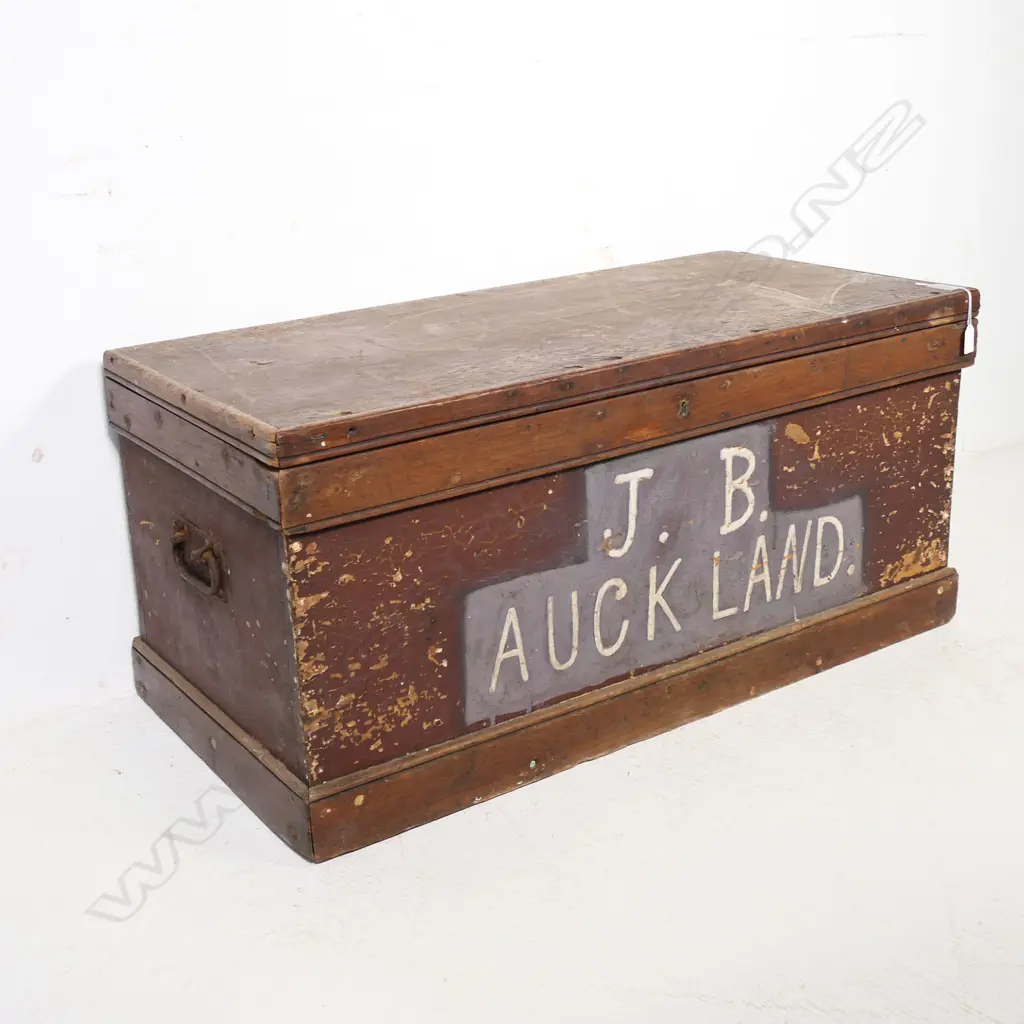 A colonial kauri carpenter's chest, dovetailed construction to the sides, plank top, steel carrying handles to the side and with fitted interior. 1040 x 490 x 510mm. Image 1++