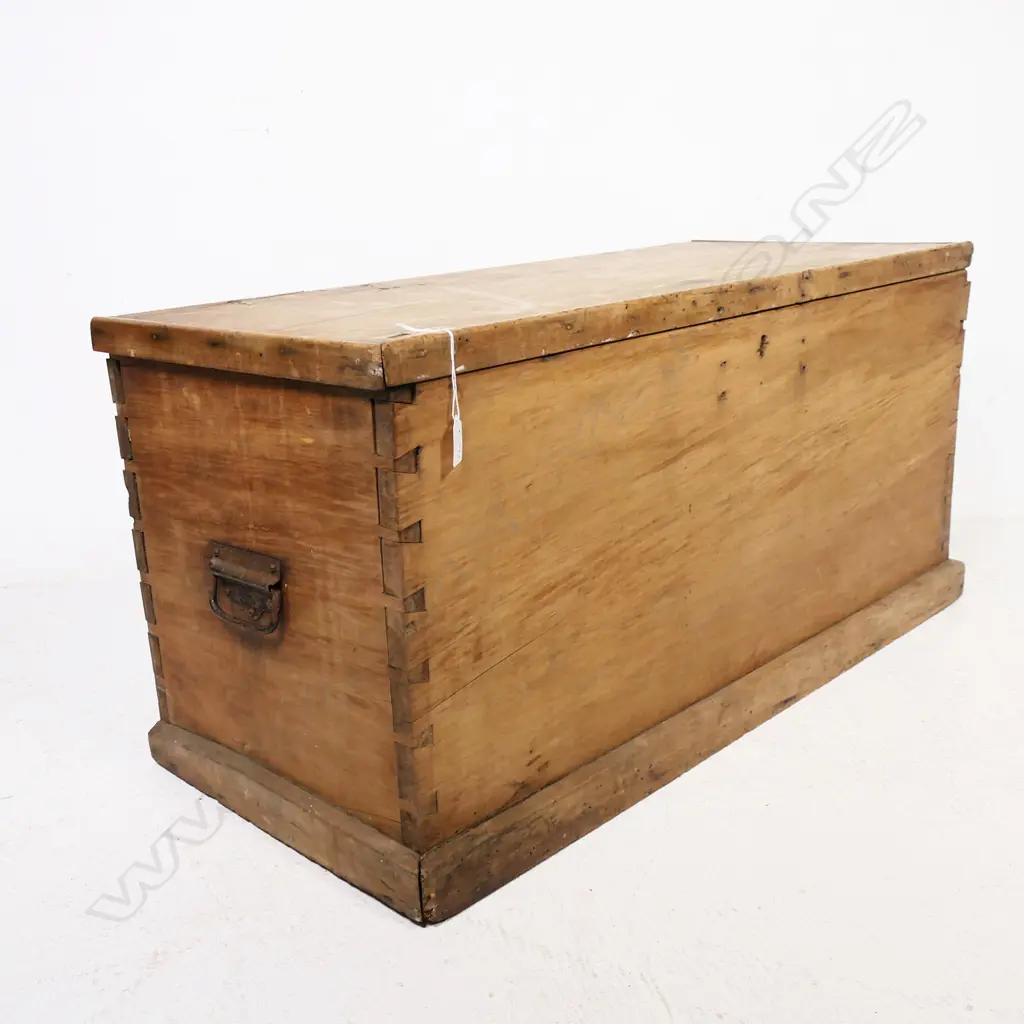 A N.Z. colonial rimu storage box of plain oblong shape with metal side handles and plinth base. 930 x 420 x 455mm Image 1++