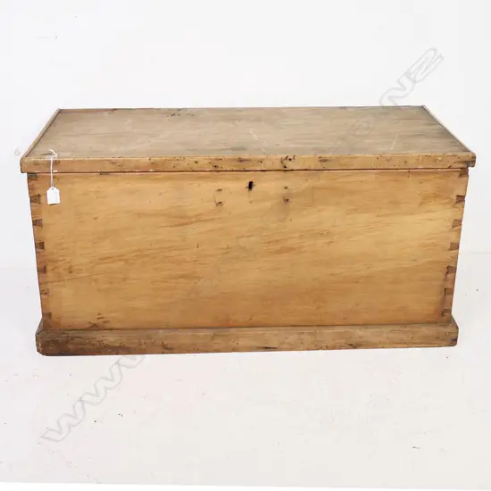 A N.Z. colonial rimu storage box of plain oblong shape with metal side handles and plinth base. 930 x 420 x 455mm