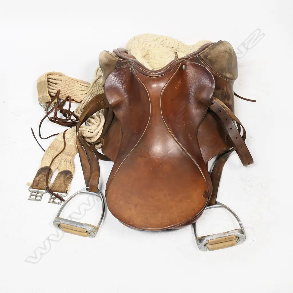 A small old leather saddle with original sheepskin blanket and girth strap Image 1++