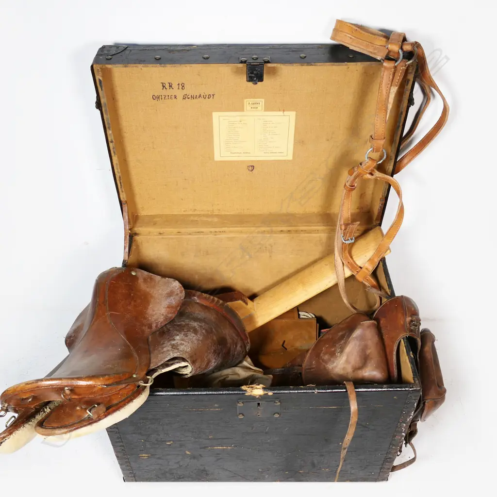A rare military saddle and extras including pair dispatch bags, in original travelling trunk, marked "Offizier Sghlauot R.R. 18". Saddlemaker's label, F. Luthi, Bern. Image 1++