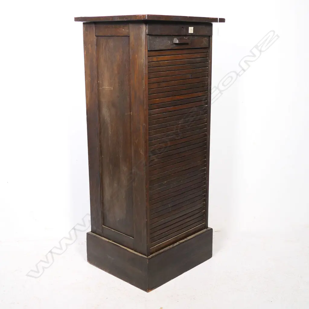 A tall oak office cabinet, with vertical tambour roll door. Locked and without key. Image 1++