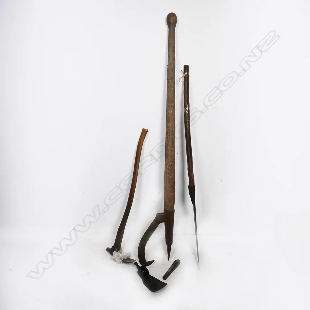 An antique French cast iron and fruitwood Coupmarc for use in a vineyard. L.1027mm, along with a log peavy and a handled adze with spare blade. Along with a long wood storage box Image 1++