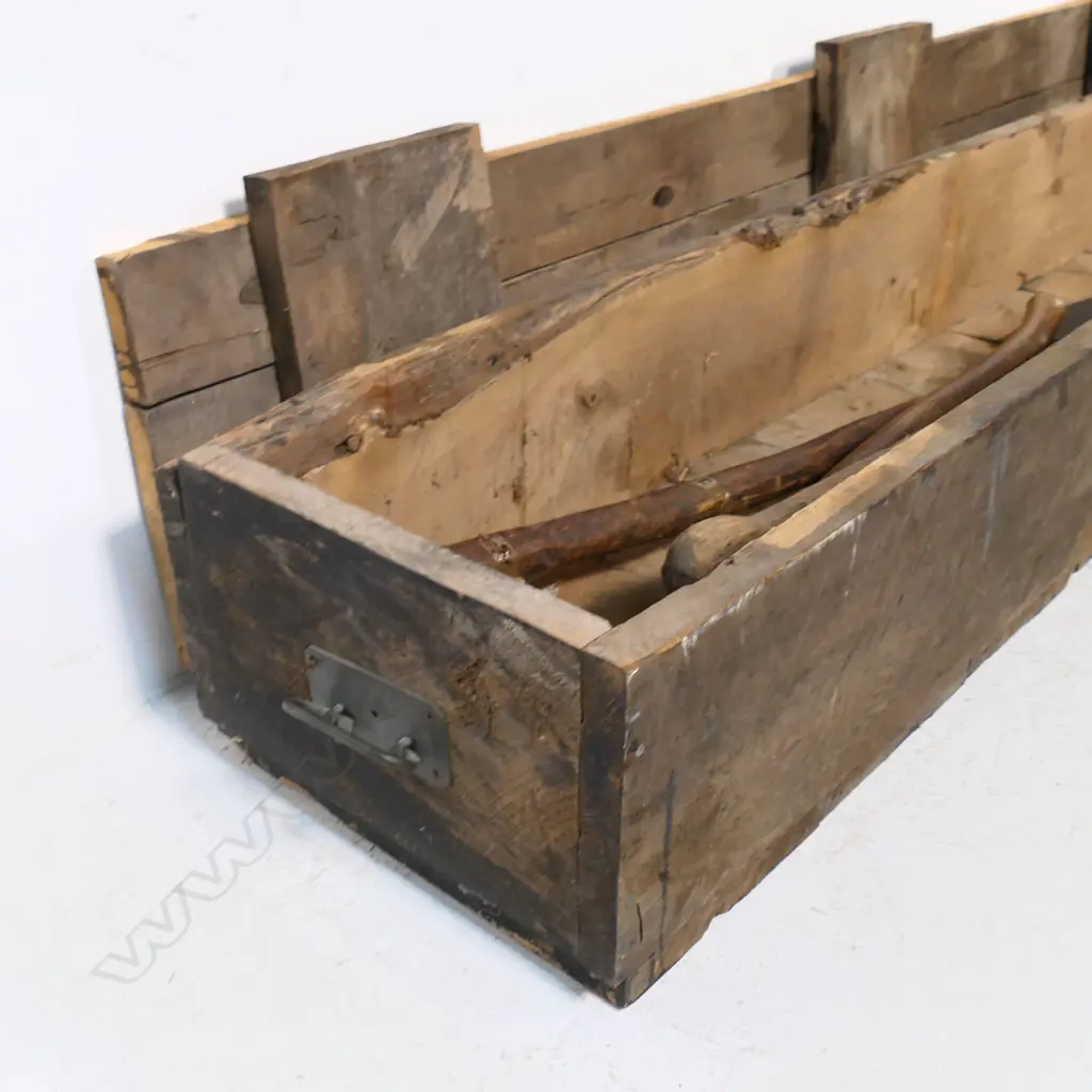 An antique French cast iron and fruitwood Coupmarc for use in a vineyard. L.1027mm, along with a log peavy and a handled adze with spare blade. Along with a long wood storage box Image 1++