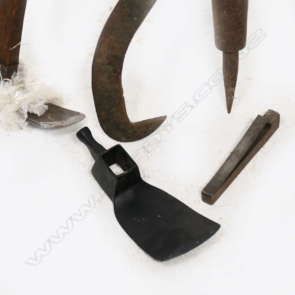 An antique French cast iron and fruitwood Coupmarc for use in a vineyard. L.1027mm, along with a log peavy and a handled adze with spare blade. Along with a long wood storage box Image 1++