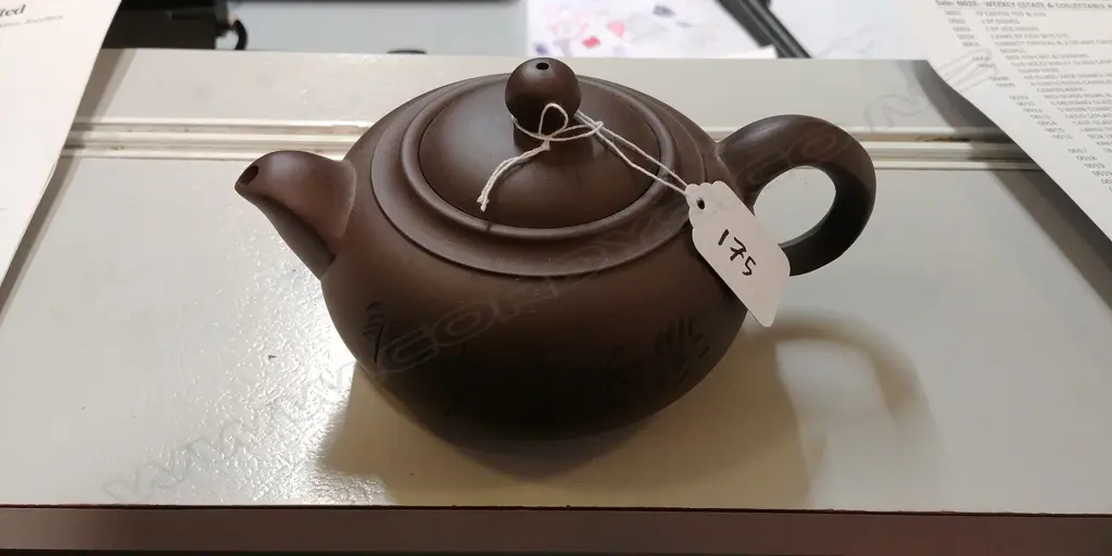 A Chinese Yixing brown terracotta teapot Image 1++