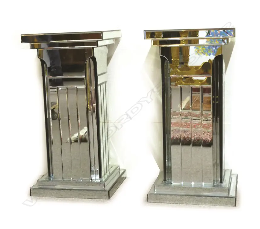 A pair of highly decorative mirrored column stands of square section Image 1++