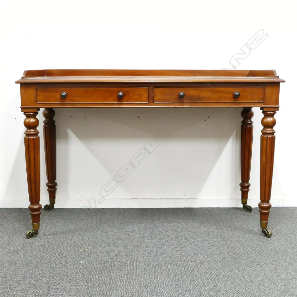 A Victorian mahogany two drawer library table Image 1++