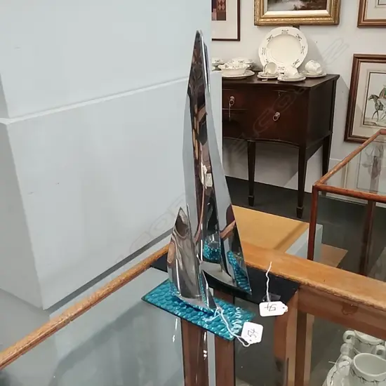 2 CHROME YACHTS ON GLASS BASES