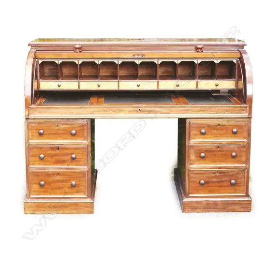 A Victorian mahogany piano top pedestal desk