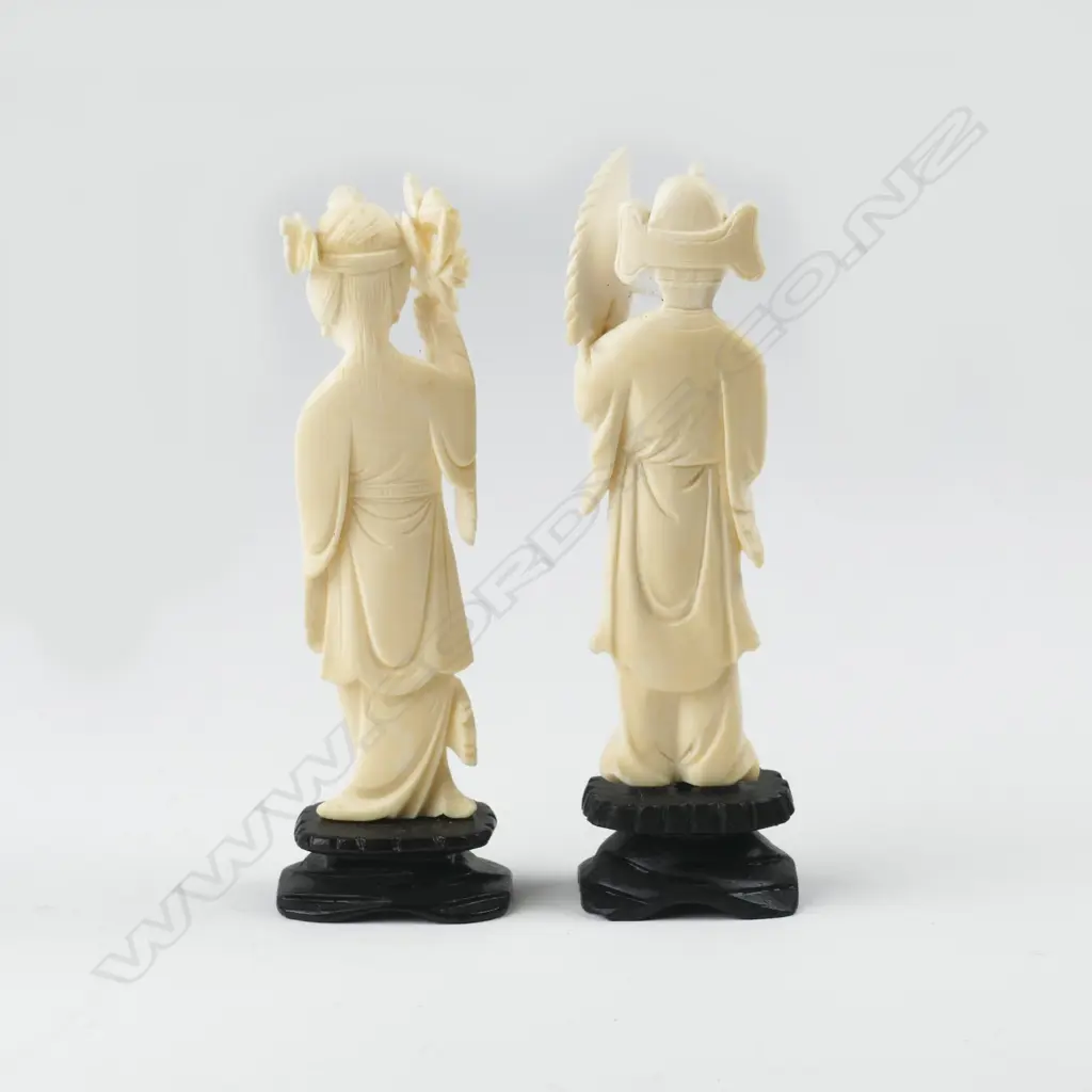 A pair of Chinese carved ivory figures of a woman and man Image 1++