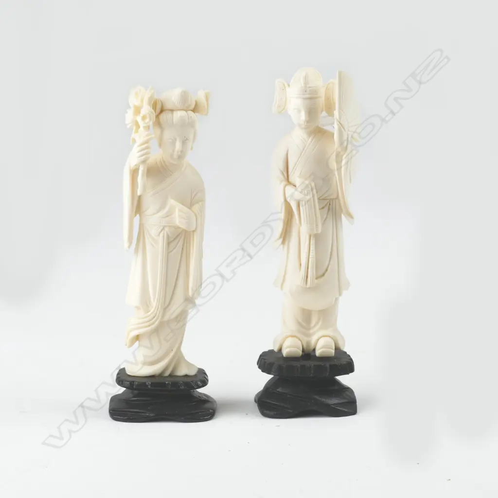 A pair of Chinese carved ivory figures of a woman and man Image 1++