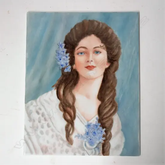 A vintage porcelain painted plaque of a young woman