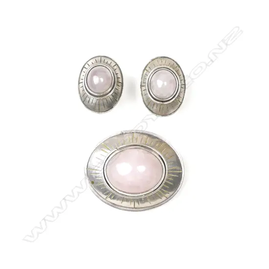 A silver and rose quartz brooch